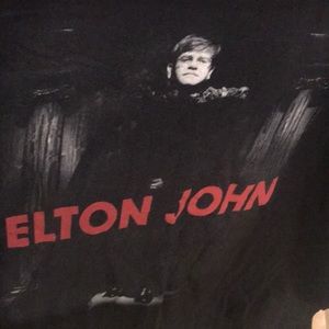 Elton John concert shirt.